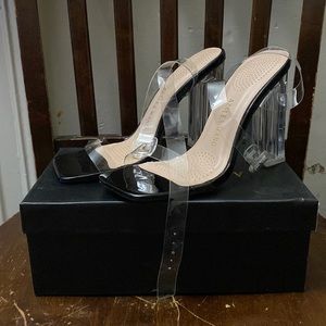 The heels are size 7.5 / shiny black new sole clear straps in Clear heel